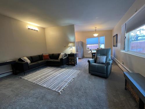 a living room with a couch and chairs and a window at Downtown Coastal Trail 2 BDR 1 BTH Sleeps 2-6 in Anchorage