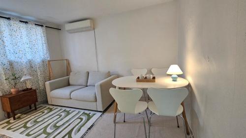 a living room with a table and chairs and a couch at Suwon Hwaseong 507, the happiest trip of my life Love Stay in Suwon