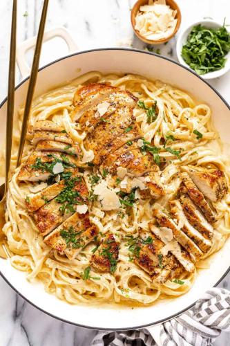 a bowl of pasta with chicken on top of it at Comfort Inn Traralgon in Traralgon