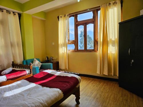 Postel nebo postele na pokoji v ubytování The Bliss Homestay