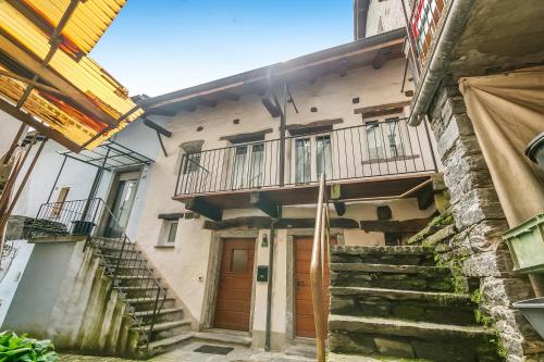 a building with stairs leading up to a door at Ca dal 1785 Centovalli - Happy Rentals in Intragna