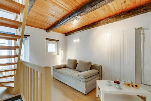 a living room with a couch and a table at Ca dal 1785 Centovalli - Happy Rentals in Intragna