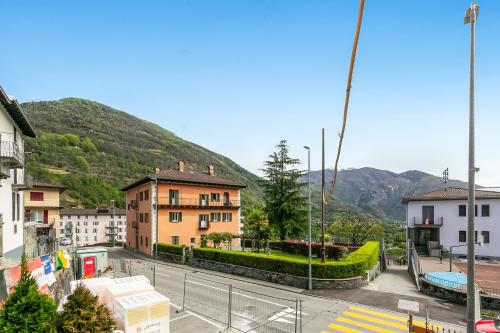 a view of a city with buildings and a mountain at Ca dal 1785 Centovalli - Happy Rentals in Intragna