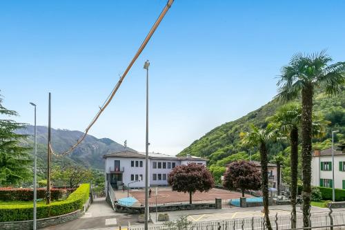 a crane in a city with buildings and palm trees at Ca dal 1785 Centovalli - Happy Rentals in Intragna