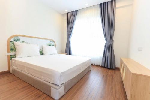 Katil atau katil-katil dalam bilik di FLC Sea Tower Quy Nhơn - Căn hộ view biển