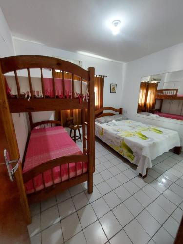 Ένα ή περισσότερα κρεβάτια σε δωμάτιο στο Boa Viagem Hostel Pequeno Príncipe