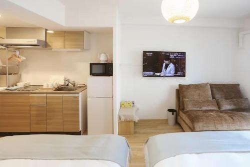 Kuchyň nebo kuchyňský kout v ubytování DL Shinsaibashi