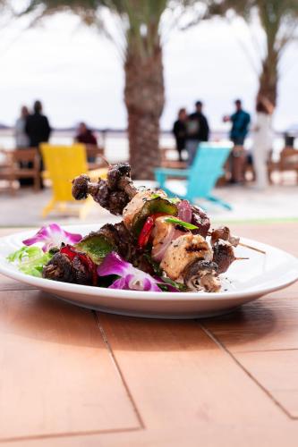 a white plate of food on a table at The Nautical Beachfront Resort in Lake Havasu City