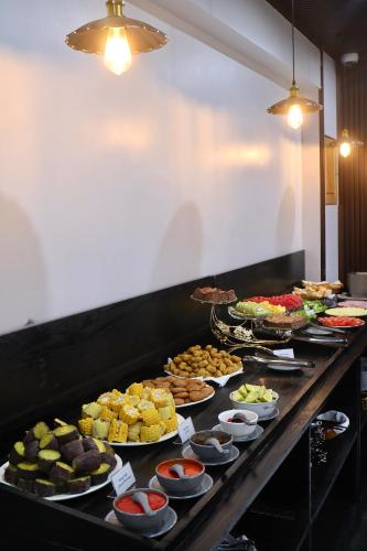 a buffet line with many different types of food at Stella De Boutique Hotel in Sa Pa