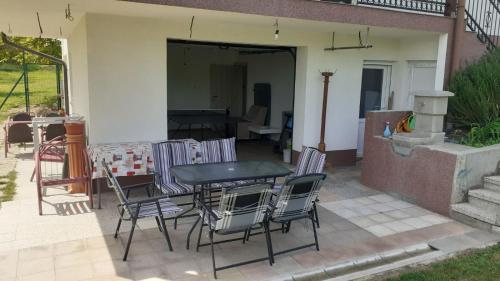 a table and chairs sitting on a patio at Apartman EXIT-TVRĐAVA in Petrovaradin