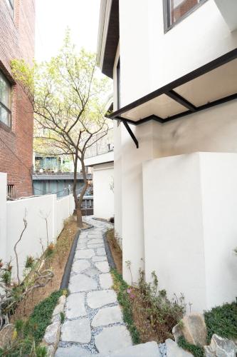 a stone walkway in front of a building at Boro Hanok Hostel in Myeongdong in Seoul