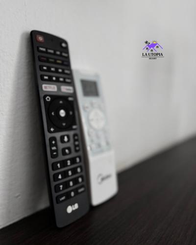 a remote control is leaning against a wall at La Utopia Resort in Arambol