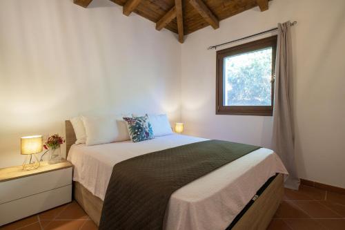 Ένα ή περισσότερα κρεβάτια σε δωμάτιο στο Villa Robi