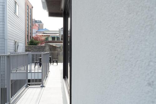 a view of a balcony from a window of a house at Boro Hanok Hostel in Myeongdong in Seoul