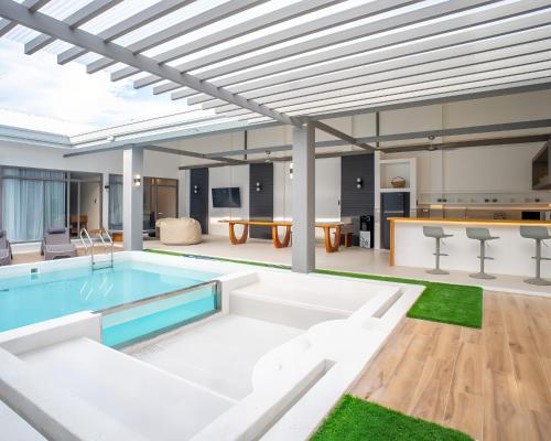 a swimming pool in the middle of a house at Villa Kalachuchi Bohol in Panglao