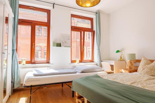 Ένα ή περισσότερα κρεβάτια σε δωμάτιο στο BELIEBT - Saale Altstadt Apartment