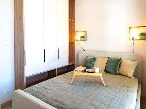 a living room with a couch and a table at MomUla's Apartment Pino Sobieszewo Gdańsk in Gdańsk