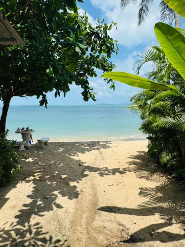 a sandy beach with a view of the ocean at Dream Villa Beachfront Sunset in Ban Bang Po