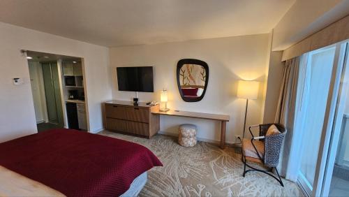a hotel room with a bed and a television at Ala Moana Hotel by Final Form in Honolulu