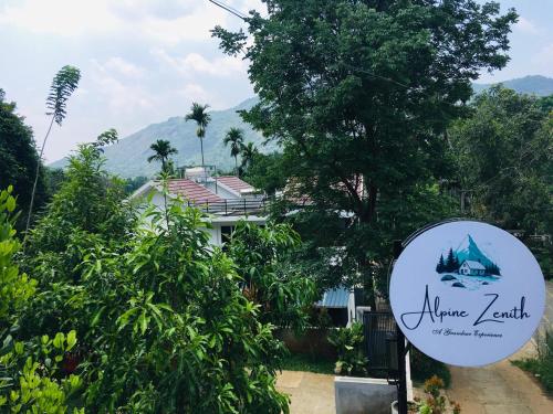 a sign in front of a house at Alpine Zenith - Luxury Wooden Cottages in Meppādi