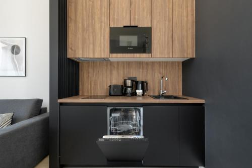 Η κουζίνα ή μικρή κουζίνα στο Shellter Apartments 117 Ł - by Jantar Apartamenty