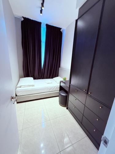 Кровать или кровати в номере Luxury Axon Residence Bukit Bintang Suites KLCC PAVILION