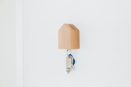 a light on a white wall with a phone on it at Rosenalm Scheidegg in Scheidegg