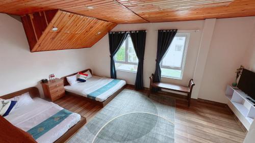 Ένα ή περισσότερα κρεβάτια σε δωμάτιο στο Dalat Hills Apartment