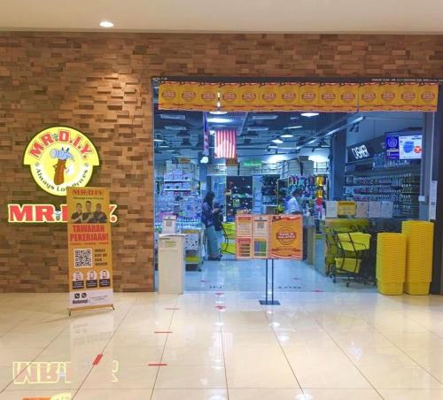 a grocery store aisle with a store entrance with yellow chairs at 2 Bedrooms Suites at Mesahill Nilai with Mall by D'KAY HOMES, near USIM KLIA in Nilai