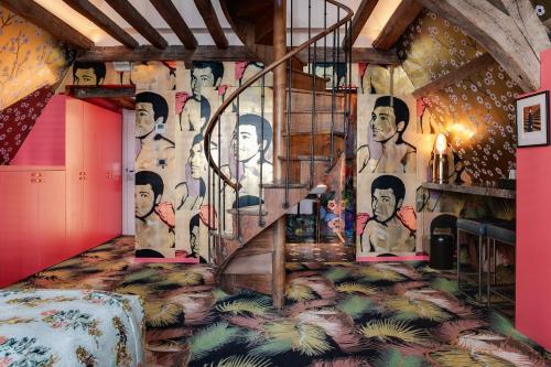 a room with a mural on the wall at Hotel De Witte Lelie -Small Luxury Hotels of the World in Antwerp