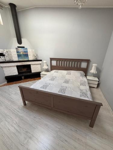 a bedroom with a large bed in a room at Apartament Konopnickiej in Dziwnów