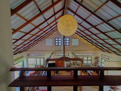 a room with a table and a large ceiling at Beach Front Villa, Saphli beach, Chumphon,Thailand in Ban Tha Samet (1)