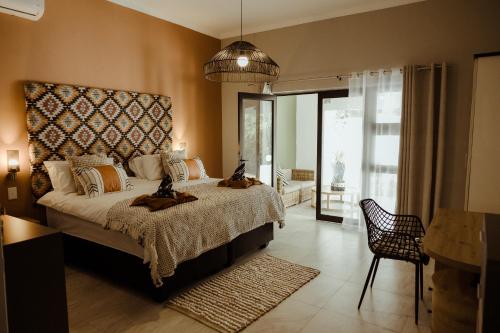 Katil atau katil-katil dalam bilik di Out of Africa Town Lodge
