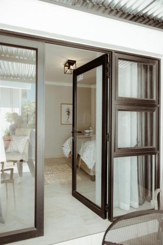 Katil atau katil-katil dalam bilik di Out of Africa Town Lodge