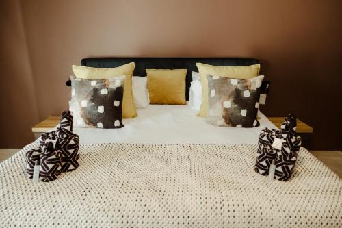 Katil atau katil-katil dalam bilik di Out of Africa Town Lodge