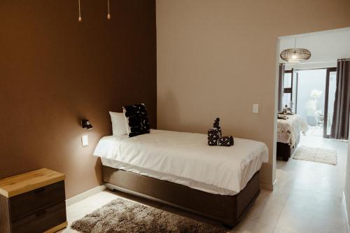 Katil atau katil-katil dalam bilik di Out of Africa Town Lodge