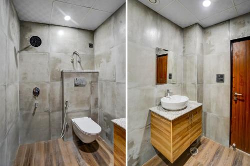 a bathroom with a toilet and a sink and a shower at Townhouse GRAND ADDRESS HOTEL AND BANQUET in Ghaziabad