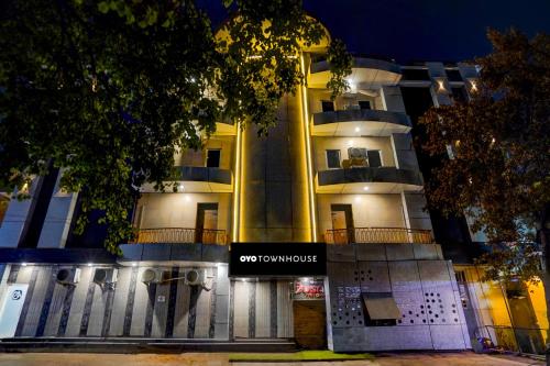 a building with a sign in front of it at Townhouse GRAND ADDRESS HOTEL AND BANQUET in Ghaziabad