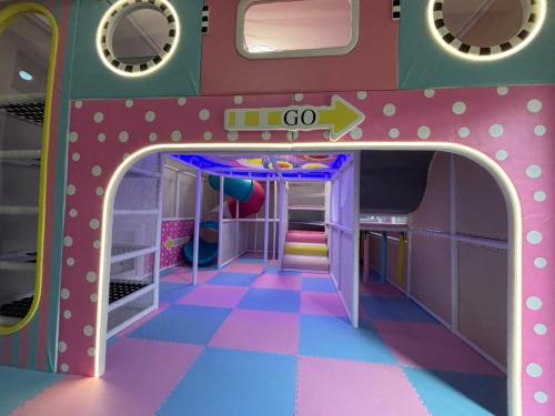 a toy train room with an open door at Six Children in Gongguan