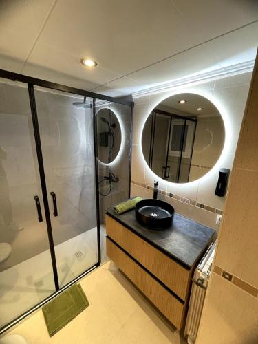 a bathroom with a sink and a shower at Apartament Mar Beach Lloret II Aqua in Lloret de Mar