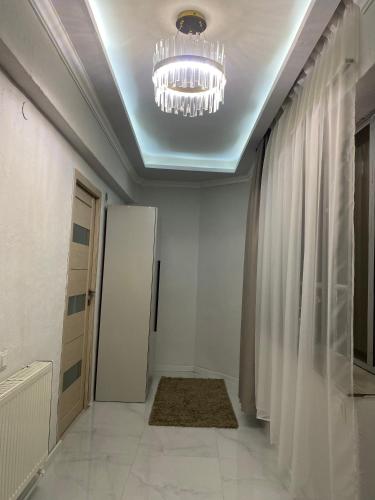 a room with a ceiling with a chandelier at Shirakatsi Guest House in Gyumri