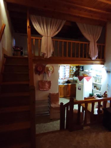 a room with a staircase leading to a living room at Studio sunrise in Kámpos