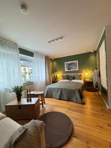 a large bedroom with a bed and a couch at Nettes Appartment in Düsseldorf-Derendorf - stylisch + gemütlich in Düsseldorf