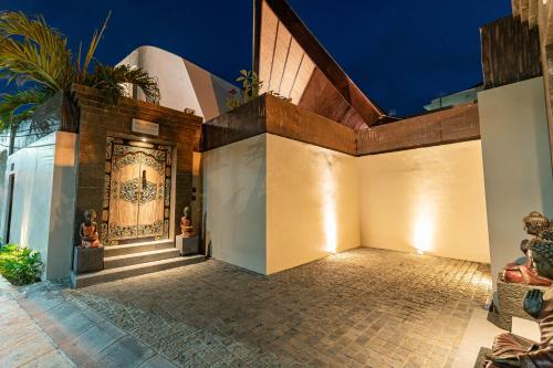 an entrance to a building with a door at Villa Bolon in Kuta