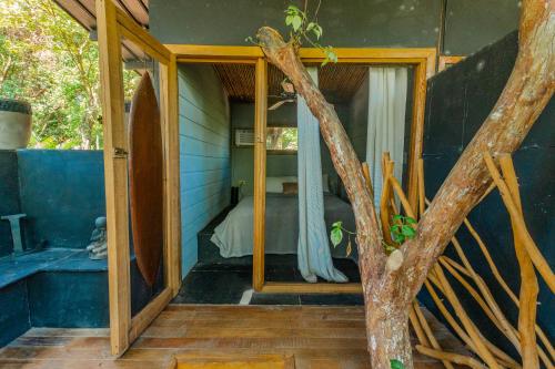 a room with a bed in a blue house at Hostel-Island Paradise, Saboga Lodge and Villa Noelia in Panama City
