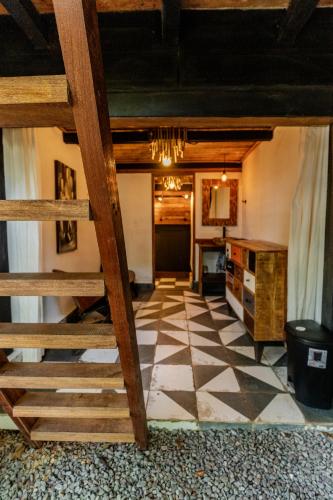 a living room with a checkered floor at Hostel-Island Paradise, Saboga Lodge and Villa Noelia in Panama City