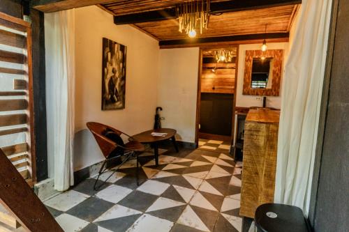 a kitchen with a table and chairs in a room at Hostel-Island Paradise, Saboga Lodge and Villa Noelia in Panama City