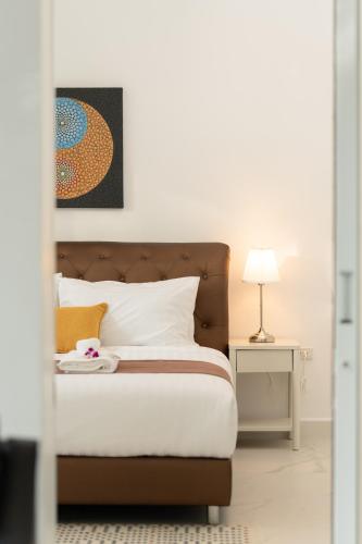 Postel nebo postele na pokoji v ubytování Osho Villas