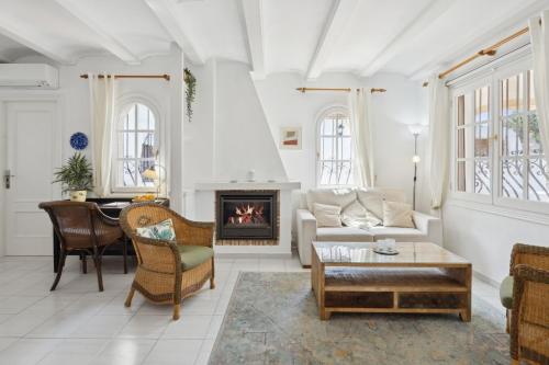 a living room with a couch and a fireplace at Nuestra Casa in Denia