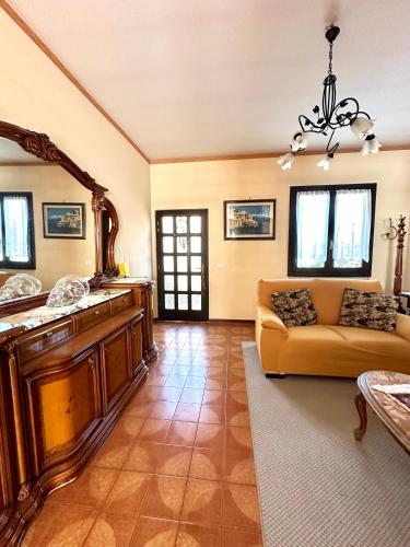 a living room with a couch and a table at Casa Rosa in Toscolano Maderno